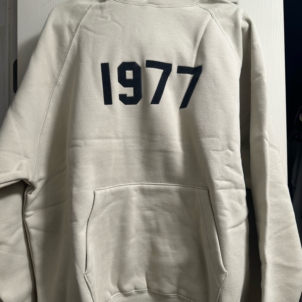 Fear of God Essentials Cream Hoodie with 1977 Print